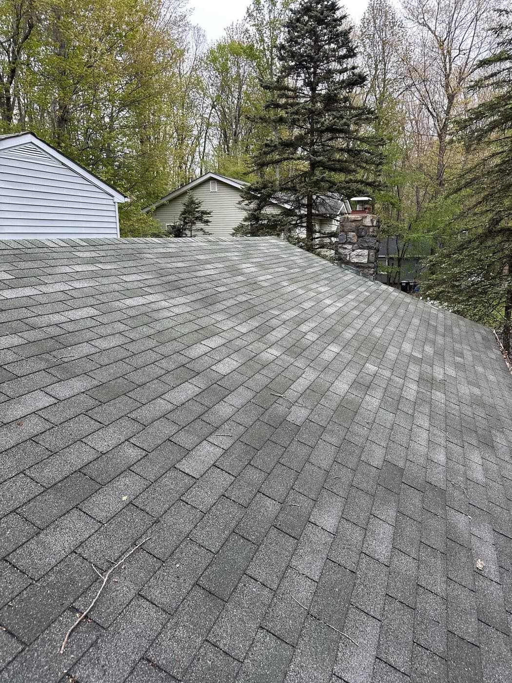 Close roof inspection photo showing shingle wear in the Pocono Summit area