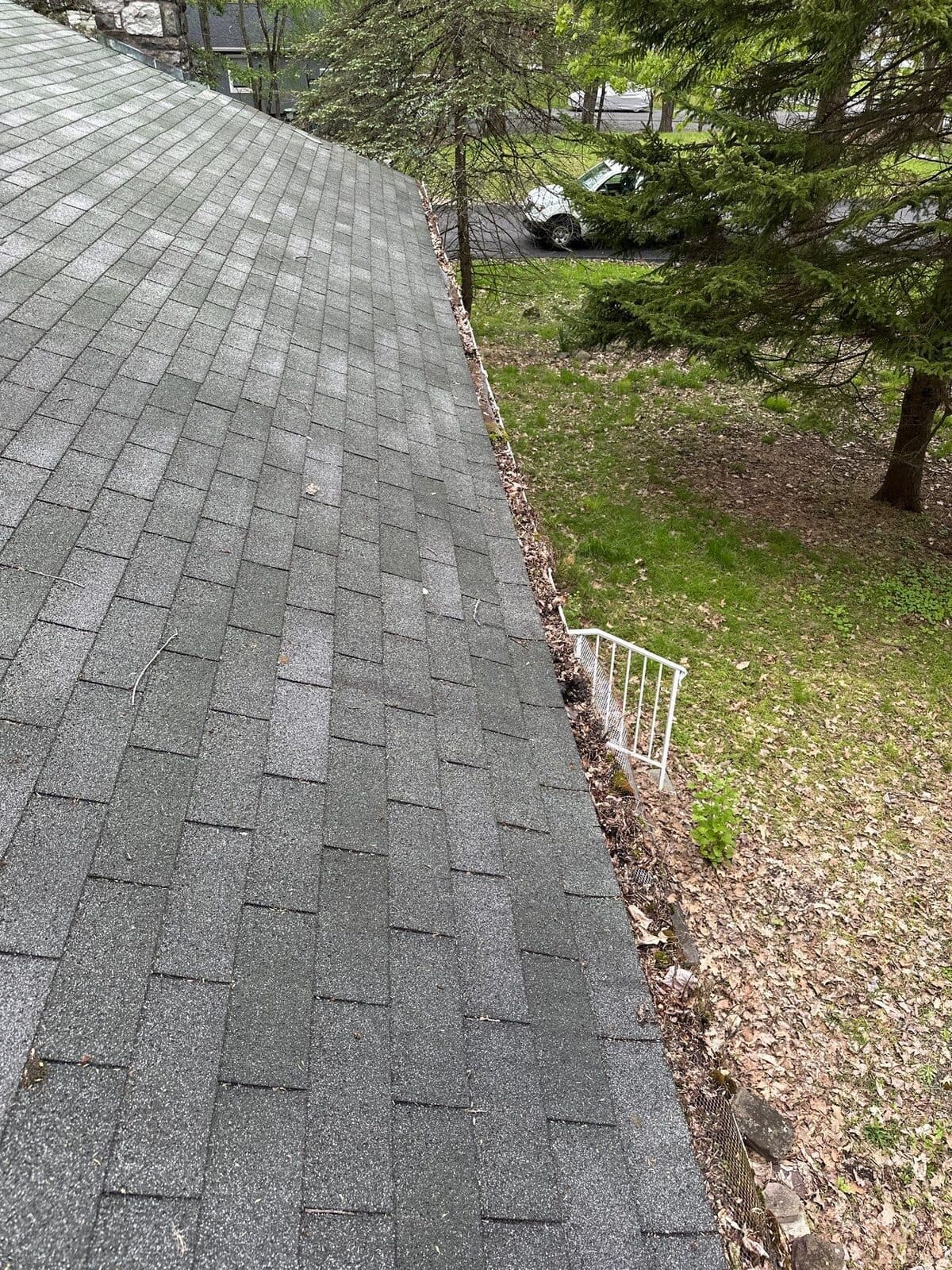 Shingle roof edge and the gutter beneath it on a Pocono Summit home